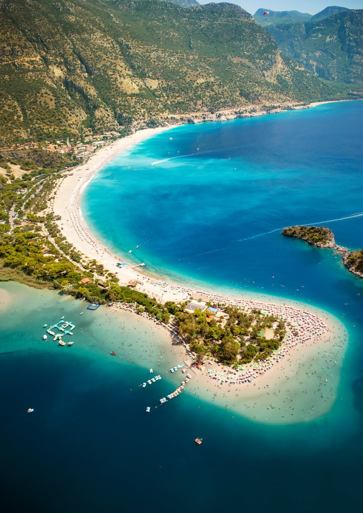 Aerial View of Beach with Mountains 